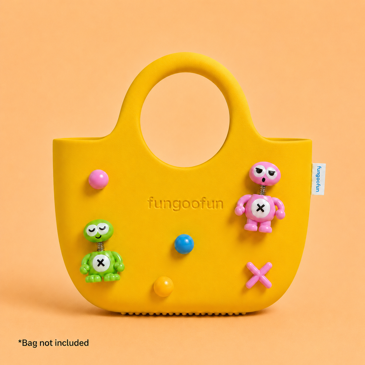 Head-Shaking_Charms_green_on_bag